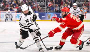 Apr 10, 2025; St. Louis, Missouri, UNITED STATES; Denver Pioneers defenseman Kent Anderson (21) blocks a shot by Western Michigan Broncos forward Owen Michaels (34) in overtime during the Frozen Four college ice hockey national semifinals at Enterprise Center. Mandatory Credit: Jeff Curry-Imagn Images