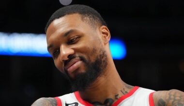 Dec 23, 2022; Denver, Colorado, USA; Portland Trail Blazers guard Damian Lillard (0) reacts towards the Denver Nuggets bench in the second half at Ball Arena. Mandatory Credit: Ron Chenoy-USA TODAY Sports