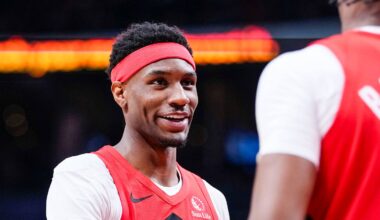 Apr 12, 2026; Toronto, Ontario, CAN; Toronto Raptors guard Ja'kobe Walter (14) celebrates a basket against the Brooklyn Nets with forward RJ Barrett (9) during the second half at Scotiabank Arena. Mandatory Credit: Kevin Sousa-Imagn Images