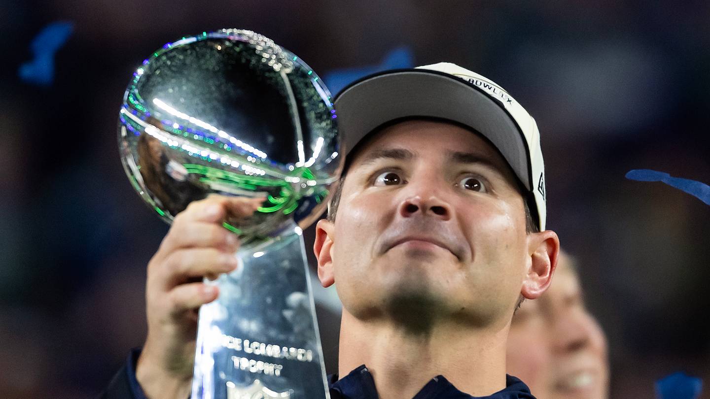 Seattle Seahawks head coach Mike Macdonald celebrates with the Vince Lombardi trophy