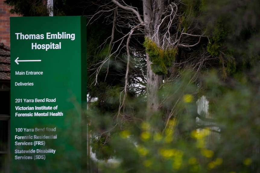 A green main entrance sign for Thomas Embling Hospital