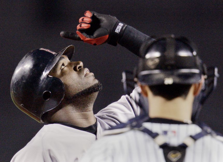 David Ortiz celebrates after hitting a two-run home run in the first inning in Game 7 of the ALCS against Yankees.