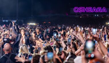 Sombr performs from a walkway through the crowd at the Osheaga Music and Arts Festival