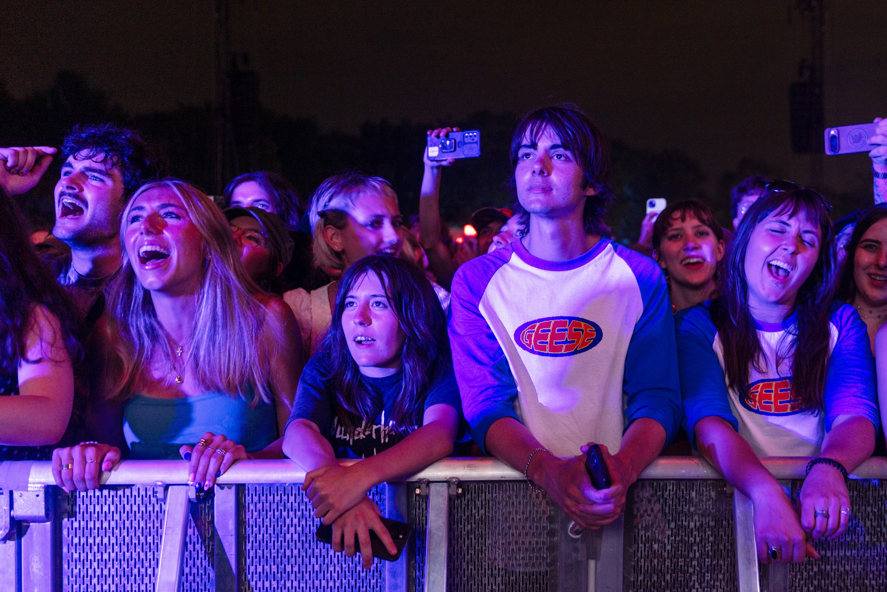 Festivalgoers sing along to Geese at the Osheaga Music and Arts Festival
