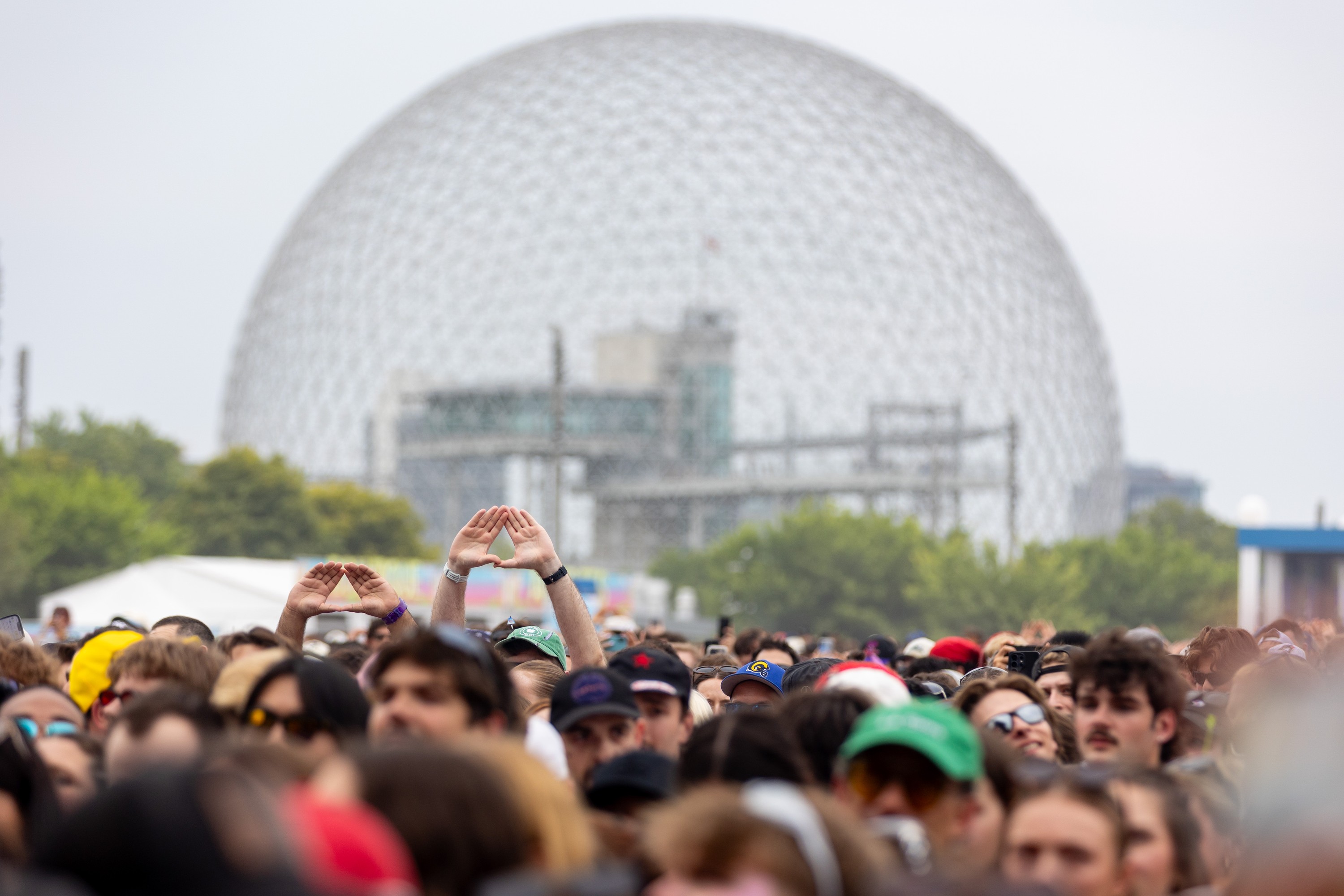Fans cheer on Angine de Poitrine as they perform at the Osheaga Music and Arts Festival