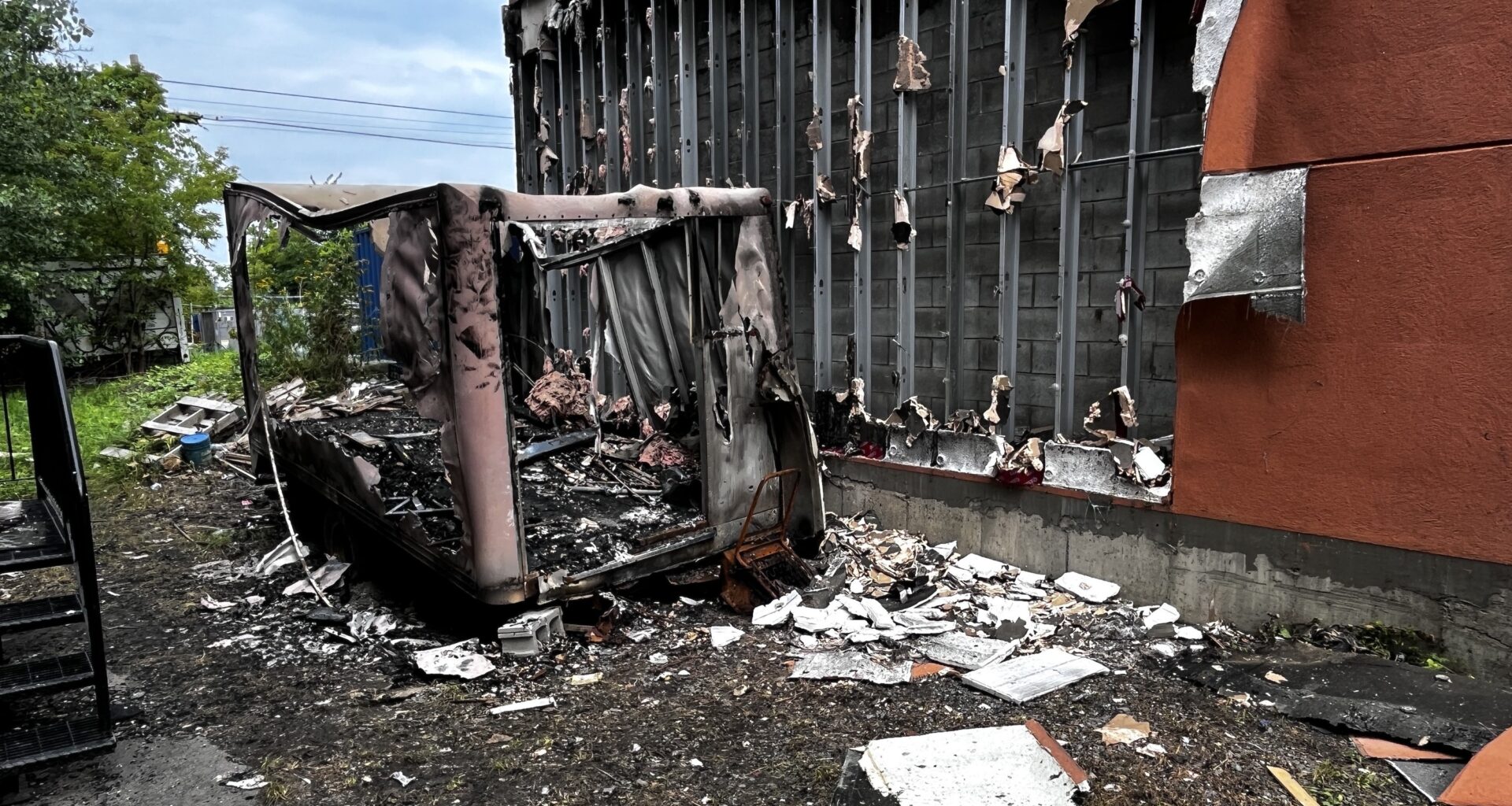 The side of a damaged building after a fire