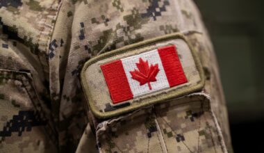 Close up of Canadian flag patch on military uniform.