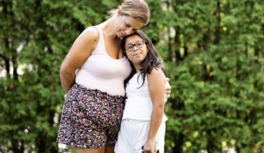 A woman and a young girl outside.