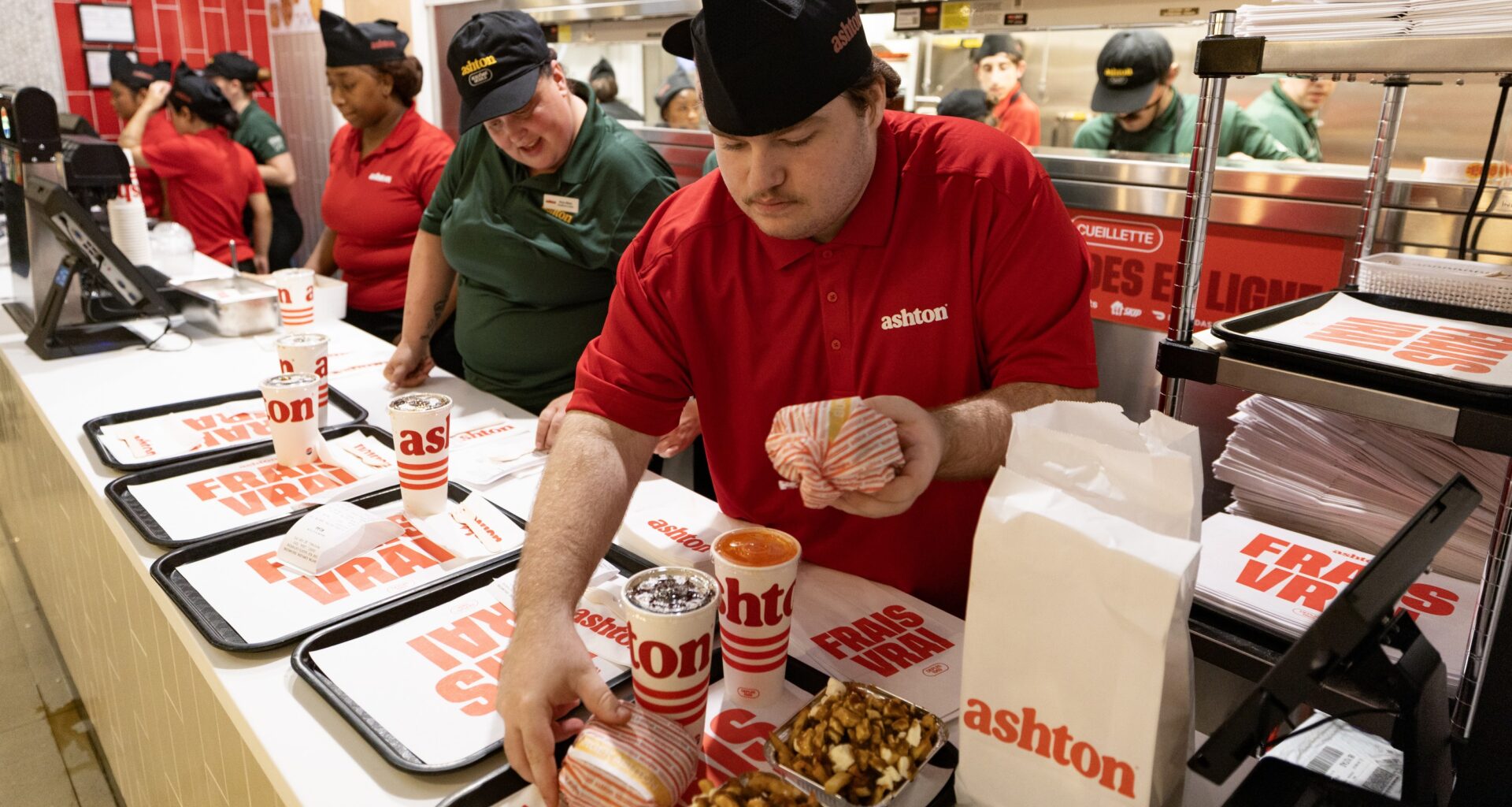 Servers prepare trays at the Ashton fast-food restaurant