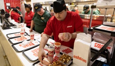 Servers prepare trays at the Ashton fast-food restaurant
