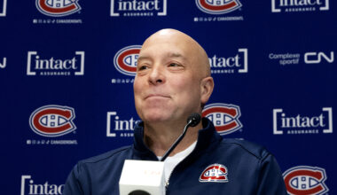 Canadiens GM Kent Hughes behind a microphone at a press conference.