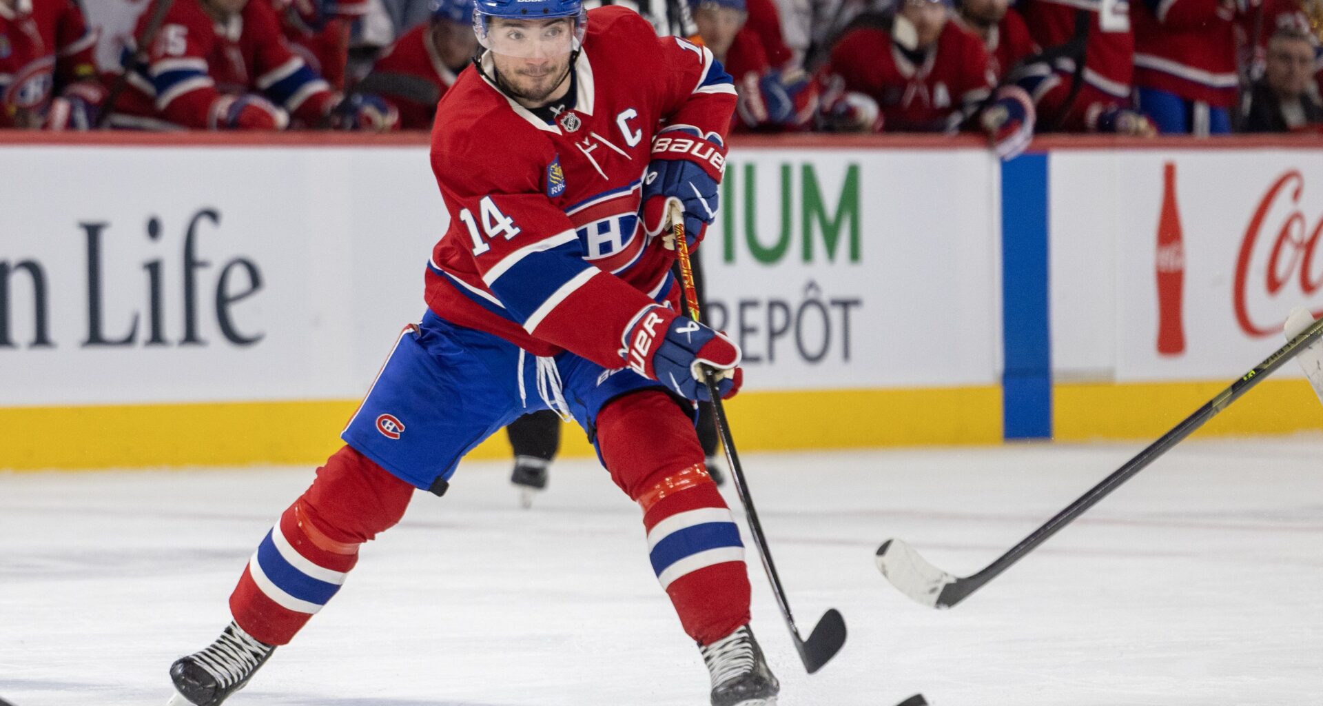 Montreal Canadiens' Nick Suzuki passes the puck during third period of National Hockey League game against the New York Islanders in Montreal Thursday February 26, 2026.
