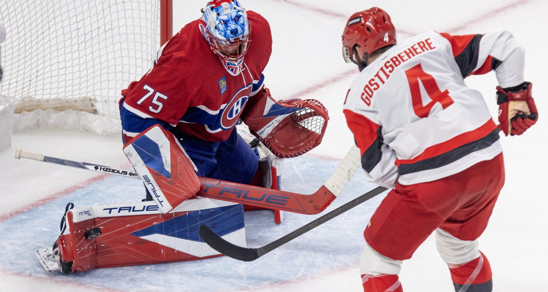 Canadiens' Jakub Dobes makes a pad save on Carolina Hurricanes' Shayne Gostisbehere during Game 3 in Montreal on May 25.