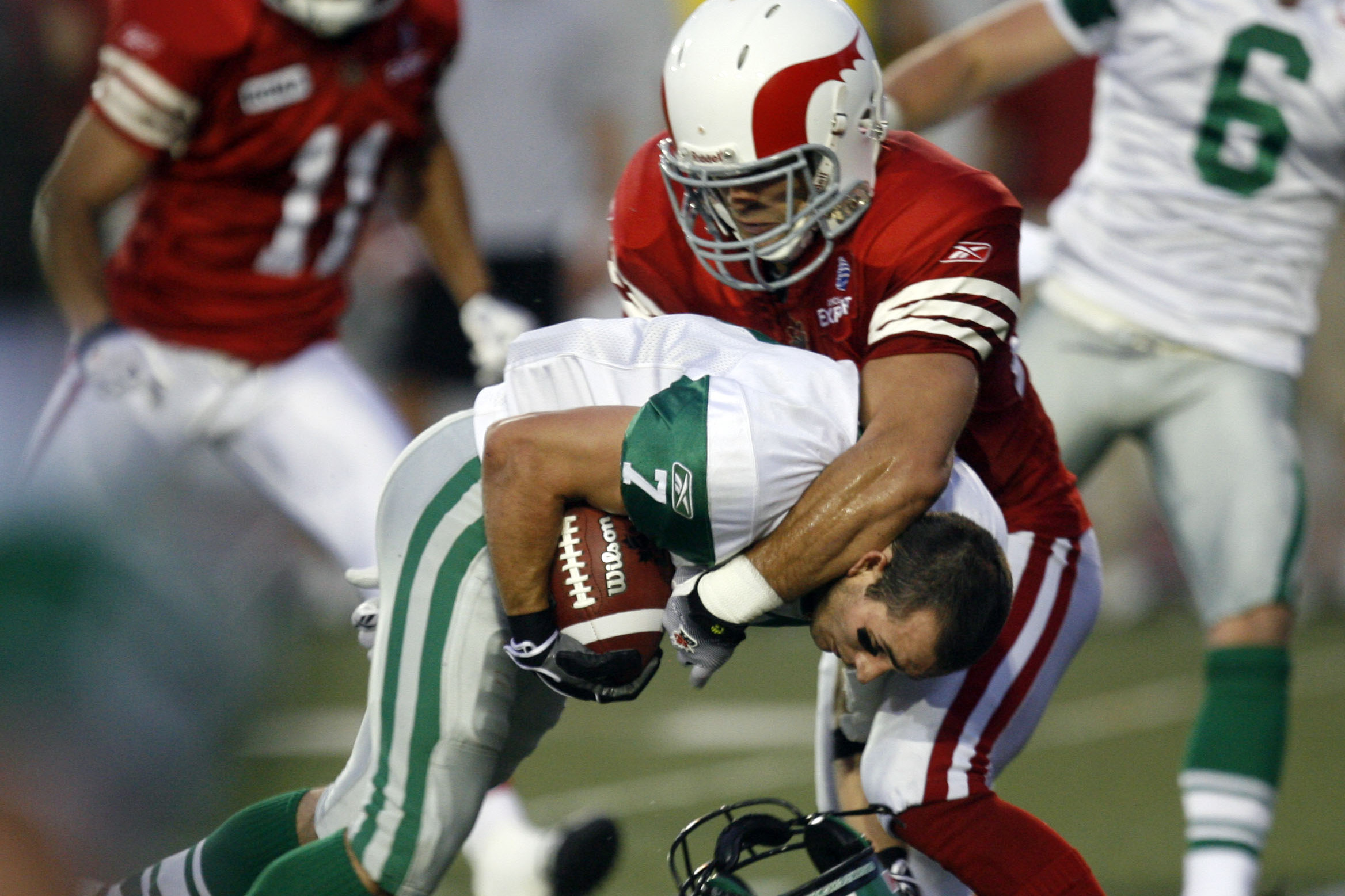 Alouettes safety Matthieu Proulx tackles Weston Dressler of the Saskatchewan Roughriders on Aug. 21, 2009, at Molson Stadium in Montreal. 
