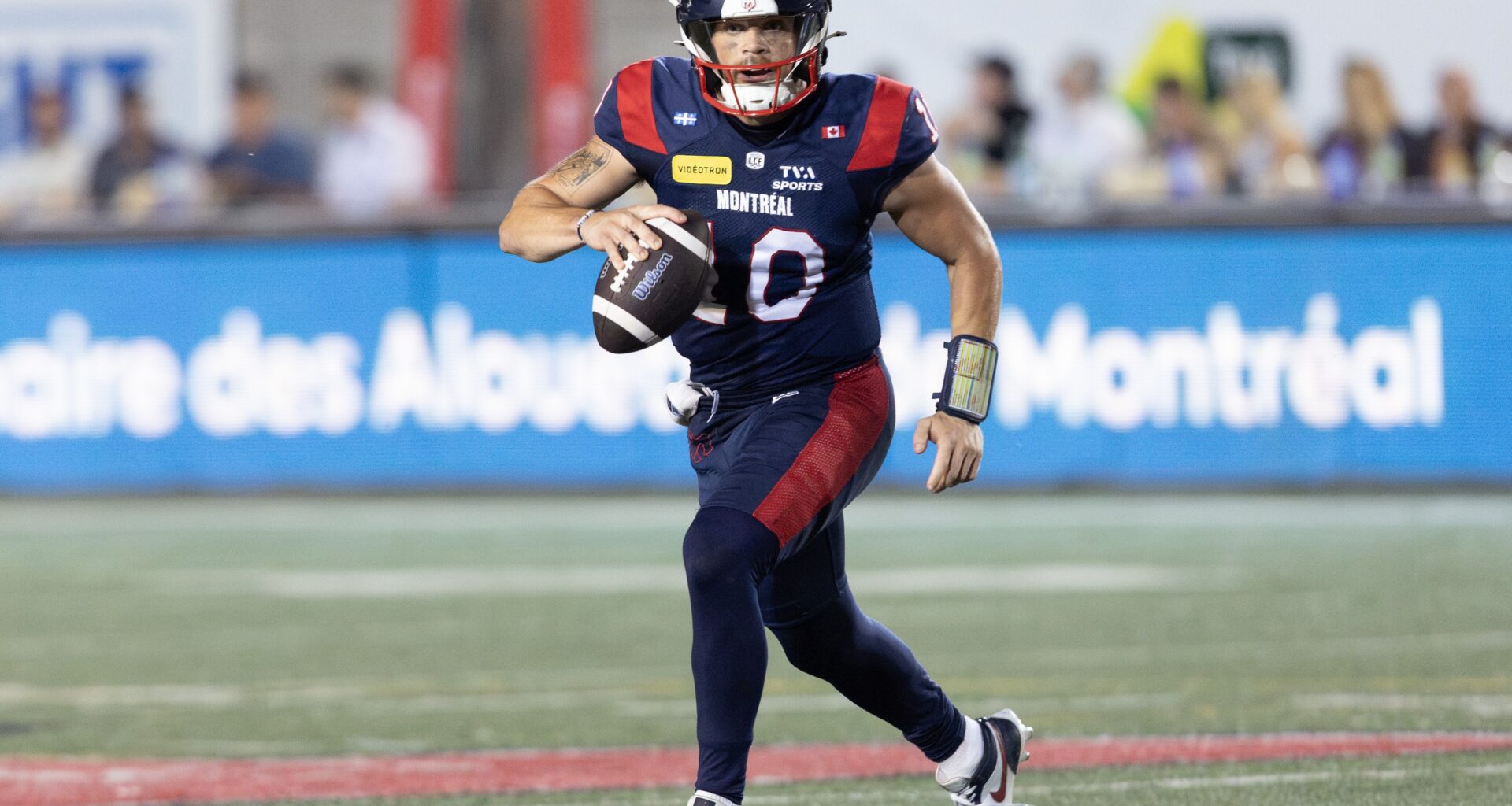 Alouettes quarterback Davis Alexander scrambles during 37-30 win over Calgary Stampeders in Montreal on July 11.