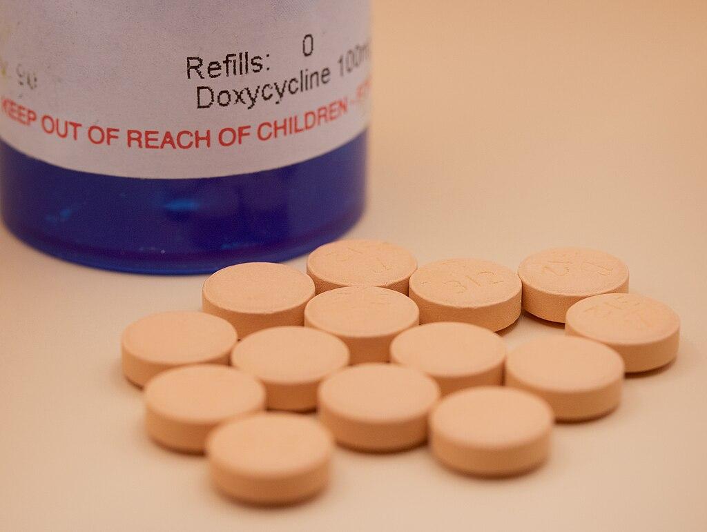 Blue bottle of doxycycline with prescription label