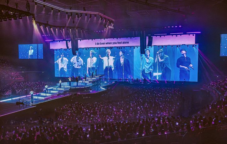 Fans of K-pop act Stray Kids cheer as the boy band performs during its world tour 'Stray Kids World Tour 'RUN IT'' at KSPO Dome in Seoul's Songpa District, Aug. 2. Courtesy of JYP Entertainment