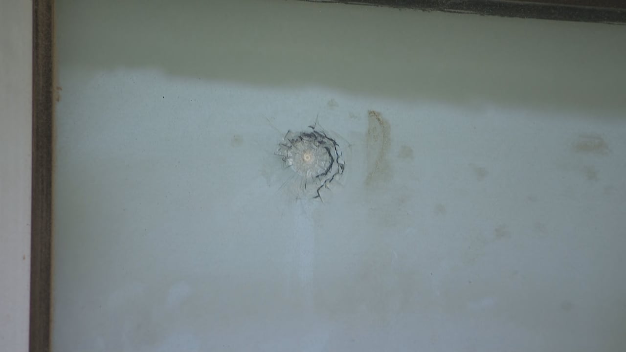 A marking in a damaged window.