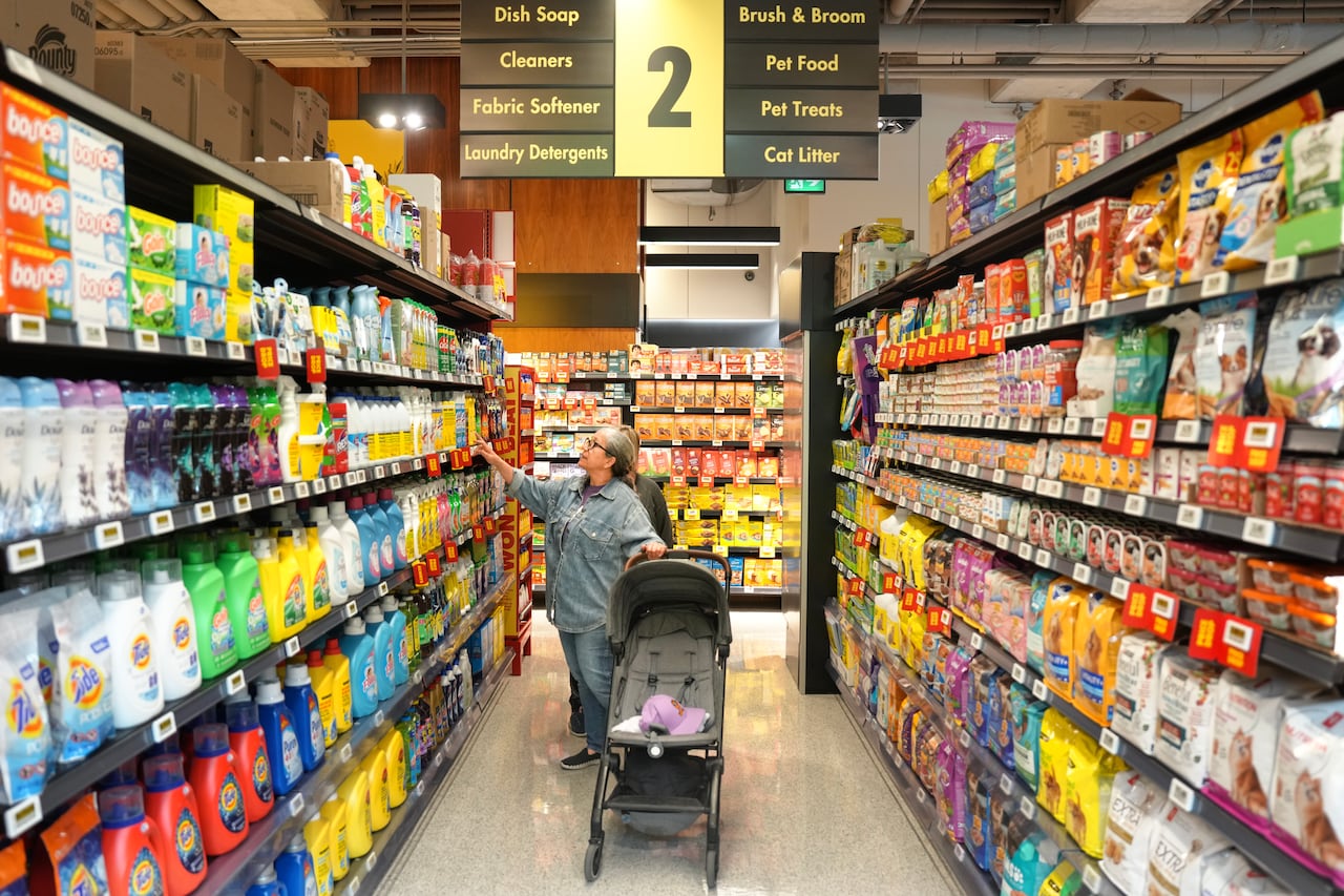 Customers shops in a new "small format" No Frills grocery store that the grocery chain is testing, in Toronto, Thursday, May 30, 2024