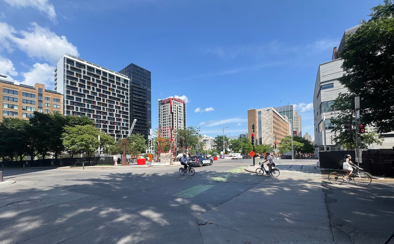 Cyclists cross an intersection in downtown Montreal.