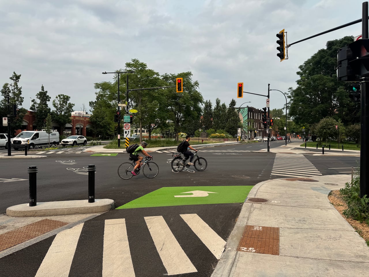 Cyclists cross an intersection.