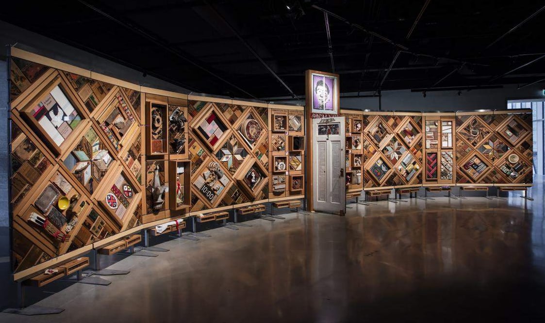 A giant wooden art installation that resembles a quilt.
