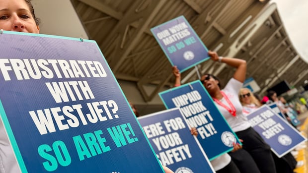 WestJet strike: Airline, union still at the bargaining table as flight attendants hit the picket lines