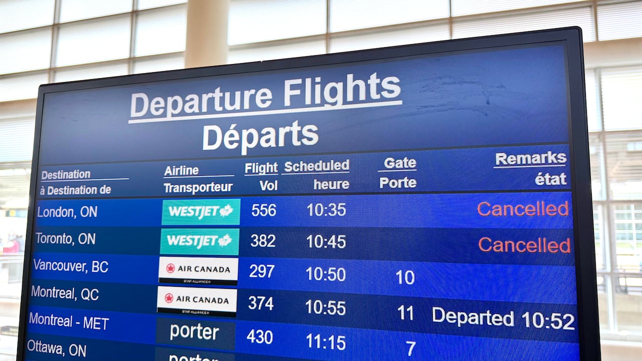 A blue screen that reads "departures" that shows several WestJet flights as "cancelled."