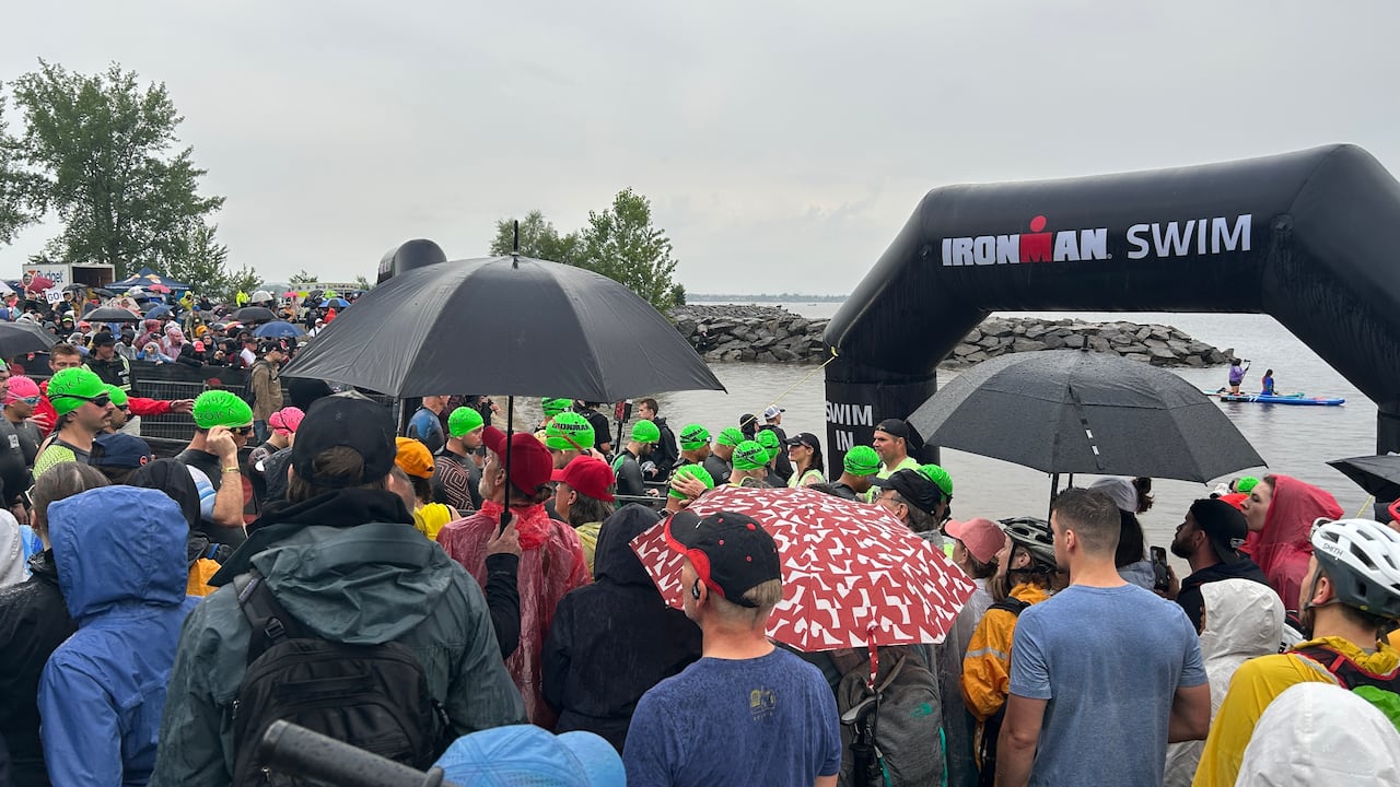 Ironman Triathlon athletes line up on Sunday morning to begin the first portion of the race. Environment Canada says Total rainfall amounts could reach 100 millimeters in some areas of the National Capital Region.