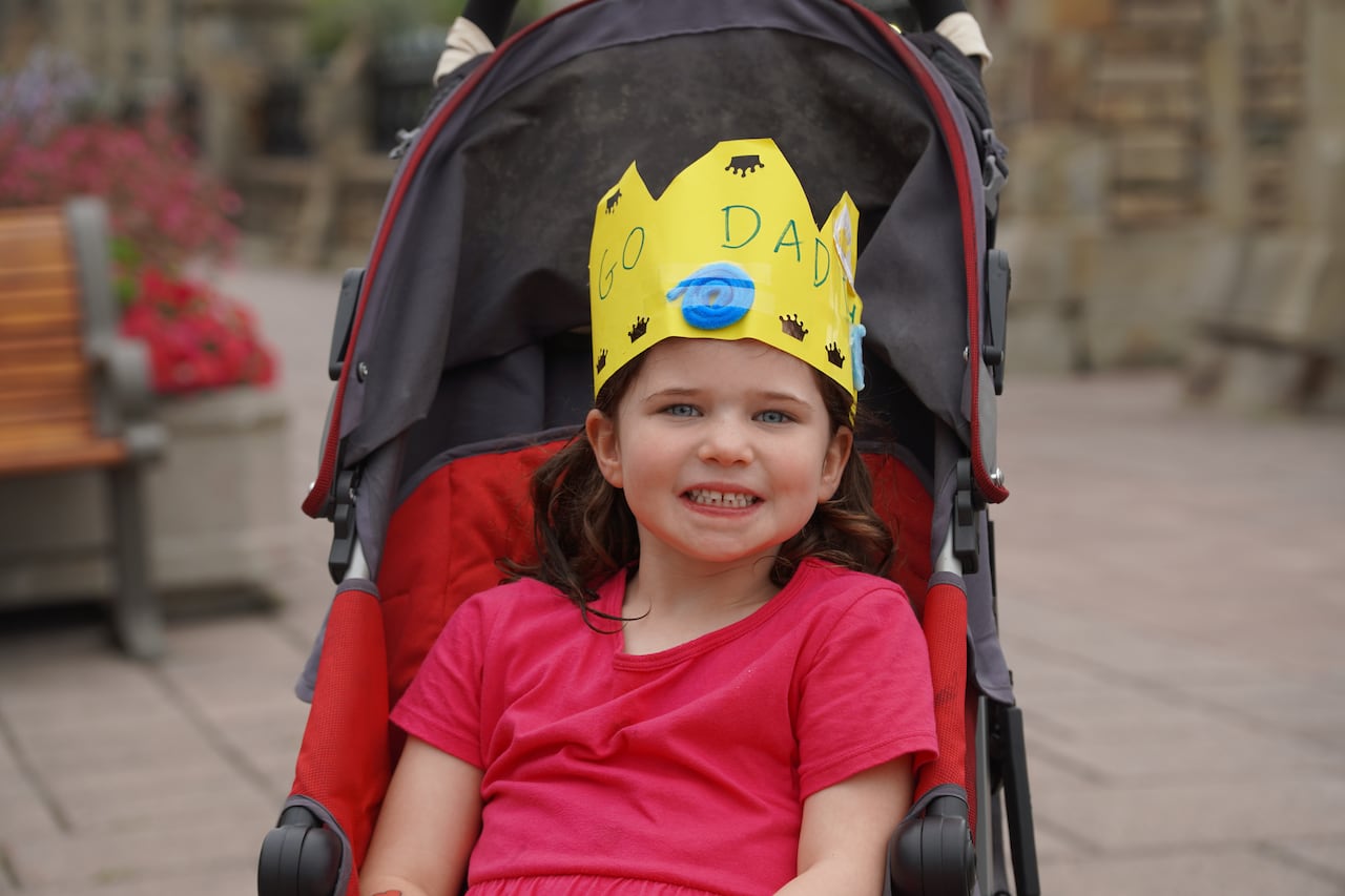With the some help from her mom, one young supporter crafted a yellow crown to wear while cheering on her father.