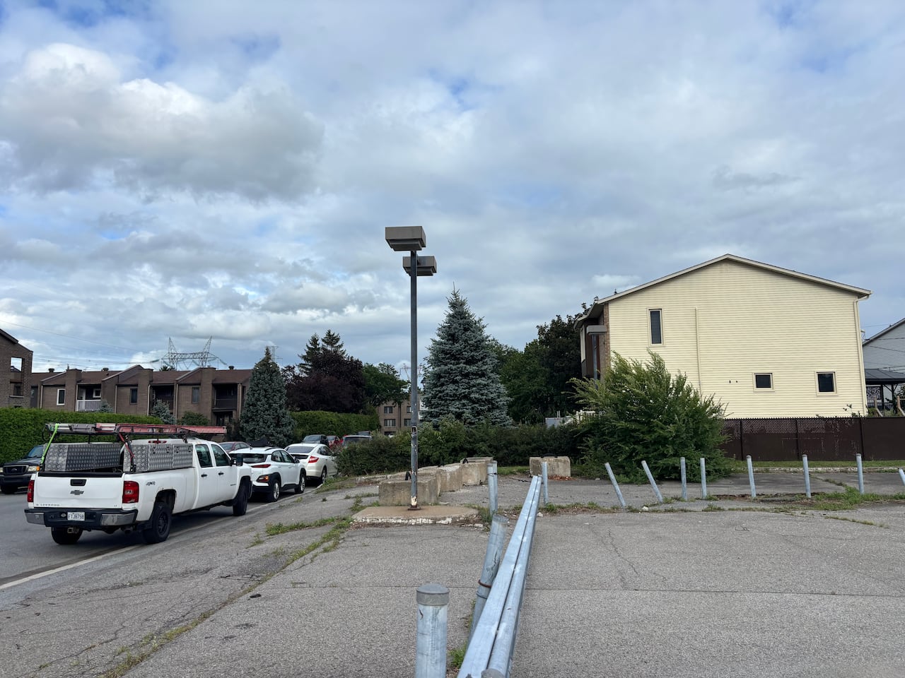 empty lot with homes in background