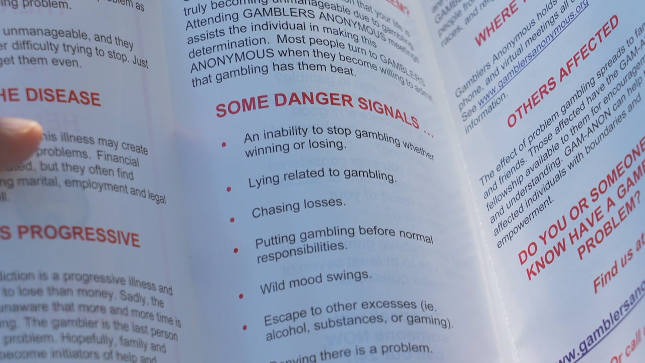 A white pamphlet with information from Gamblers Anonymous on problem gambling