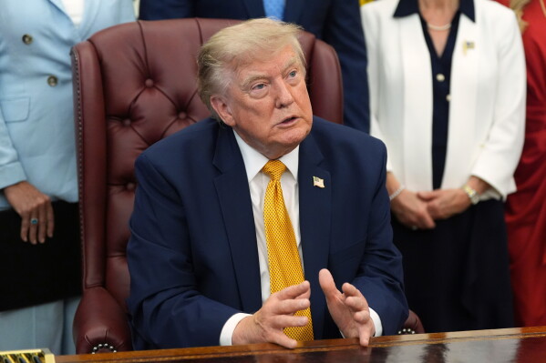 President Donald Trump speaks during a meeting about military families, in the Oval Office of the White House, Monday, Aug. 3, 2026, in Washington. (AP Photo/Alex Brandon)