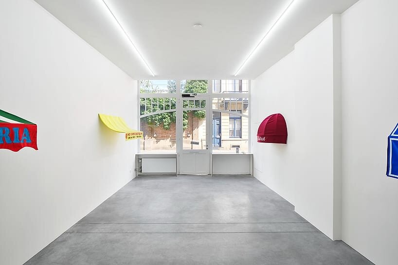 storefront canopies leave the streets behind to become sculptures of urban identity - 3