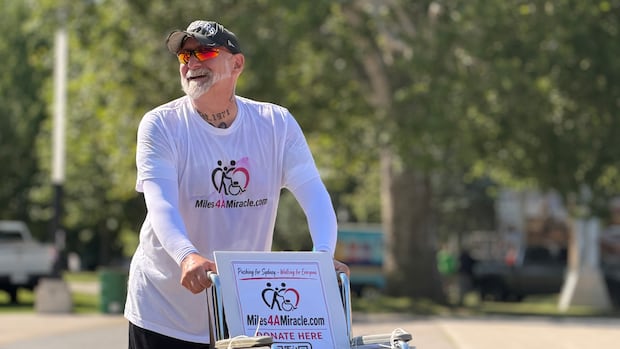 London father pushes daughter's wheelchair 200 kilometres to advocate for access to health care