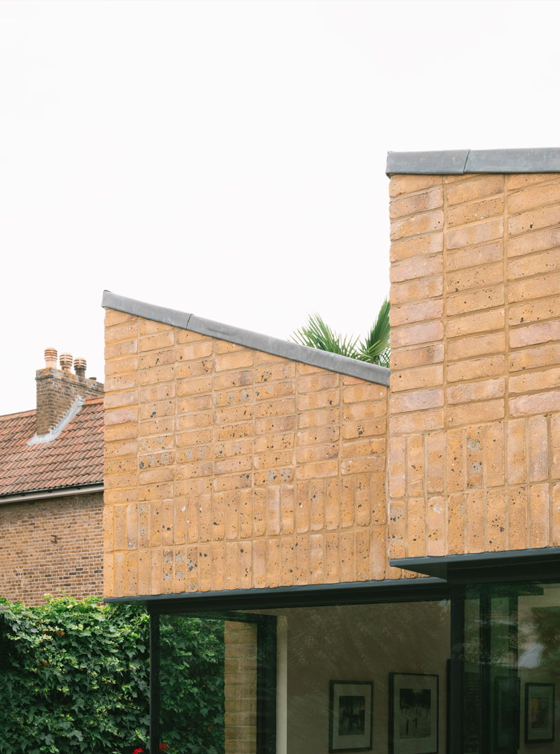 sawtooth house by francesco pierazzi architects reimagines a victorian home through a distinctive sawtooth roof 2