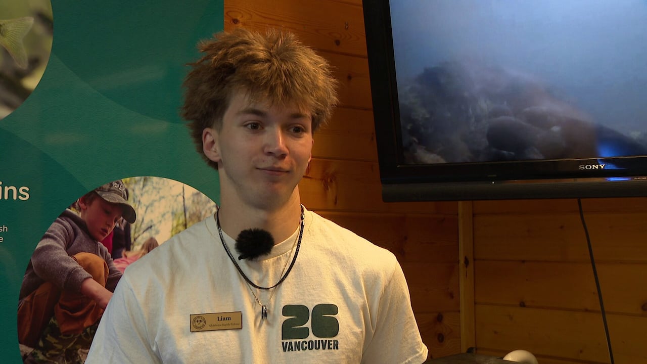 A head shot of a boy wearing a name tag.