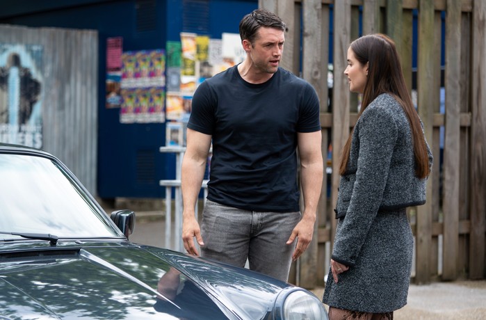 Lauren and Mark have an argument beside a car in EastEnders