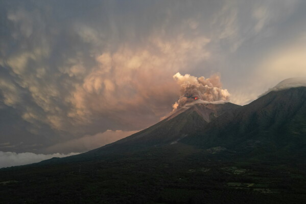 Lava flows out of the crater of the Fuego Volcano, as seen from San Juan Alotenango, Guatemala, Tuesday, Aug. 4, 2026. (AP Photo/Moises Castillo)