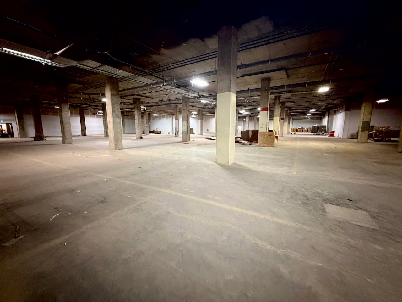 An empty concrete space with pillars.