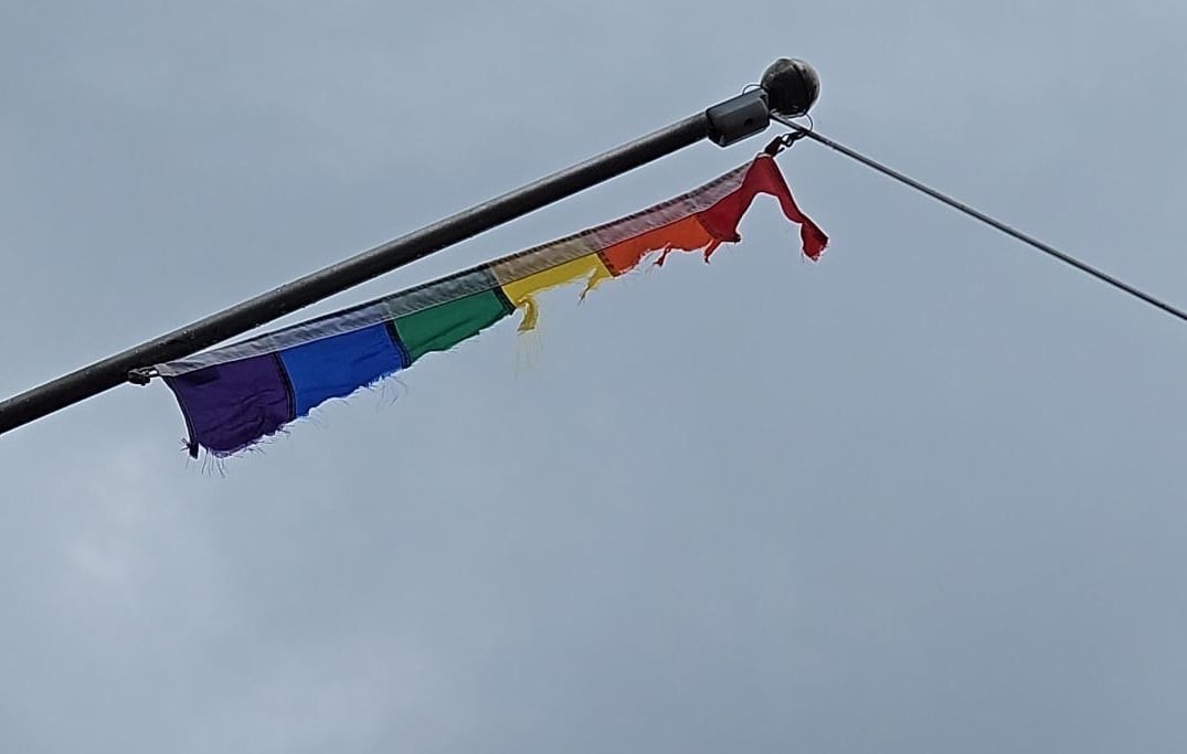 A Pride flag flying at the train station in Val-David, Que., was vandalized.