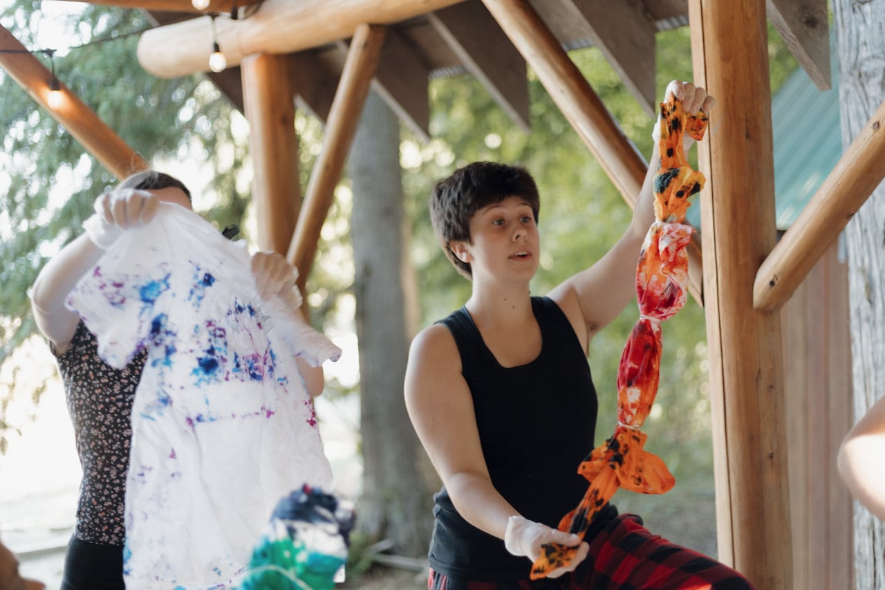 Adult campers making tye-dye.