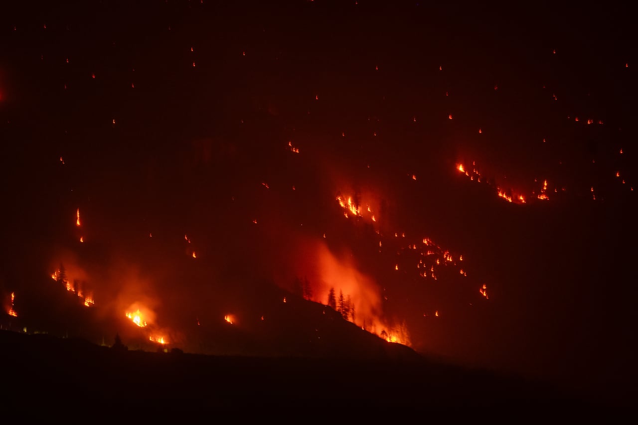 The Bald Range fire is pictured burning between Summerland and Peachland taken from Naramata, British Columbia, on Saturday, Aug. 8, 2026.