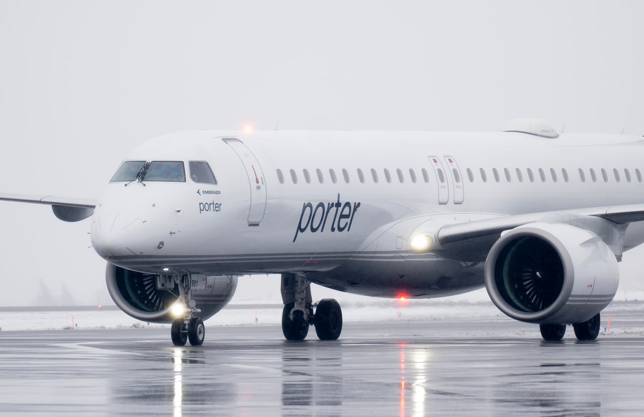 A white Porter Airlines plane on the tarmac