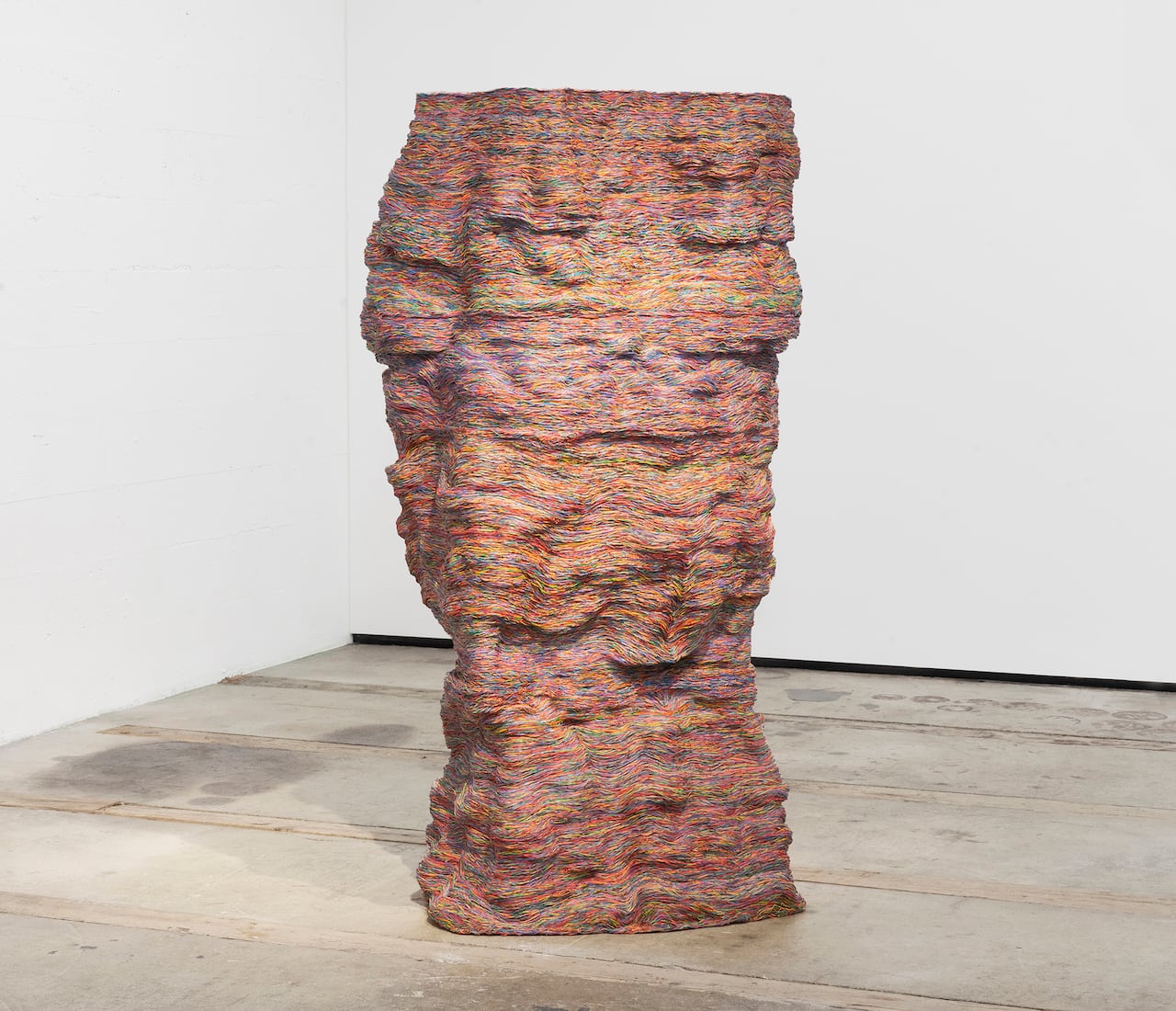 A cyclone-like sculpture made of woven telecommunications wire.