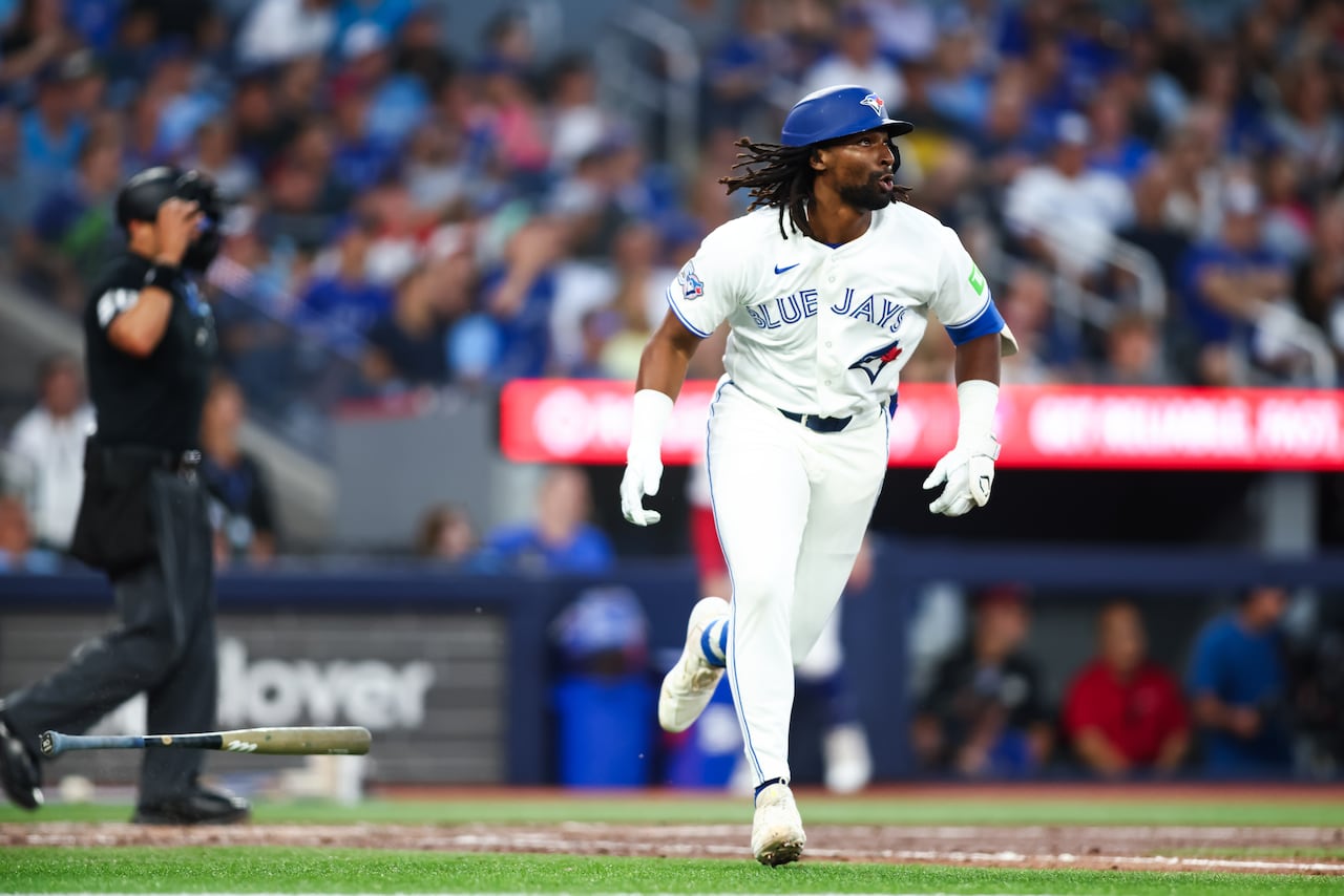 Blue Jays rookie Charles McAdoo runs the bases after hitting a solo homer in a game against the Boston Red Sox.