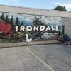 Festival-goers sit outside Irondale, Alabama's city hall on I Love Irondale Day, July 18, 2026.