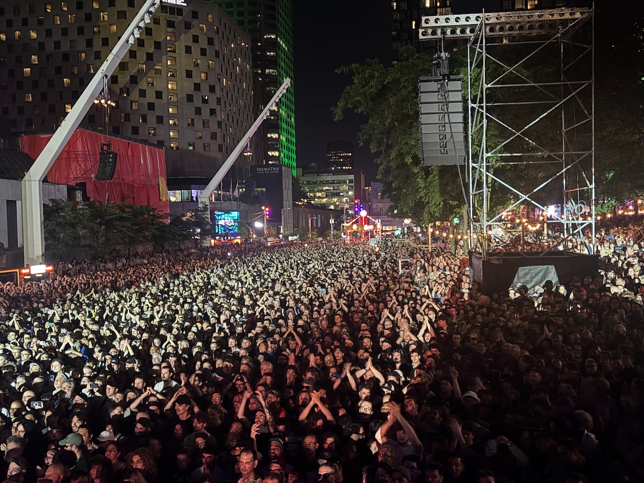 hordes of people flocked to Place des Festivals to attend the free concert by the Saguenay-based band Angine de Poitrine.
