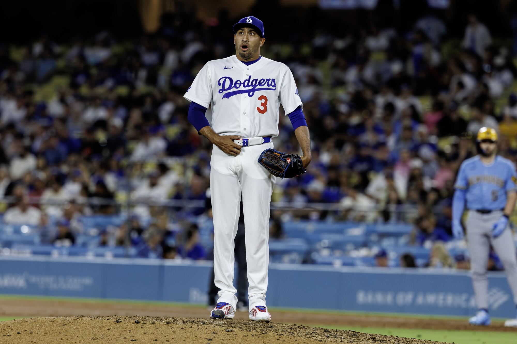 Dodgers pitcher Edwin Díaz reacts after giving up the tying run in the ninth inning against the Brewers on Thursday.