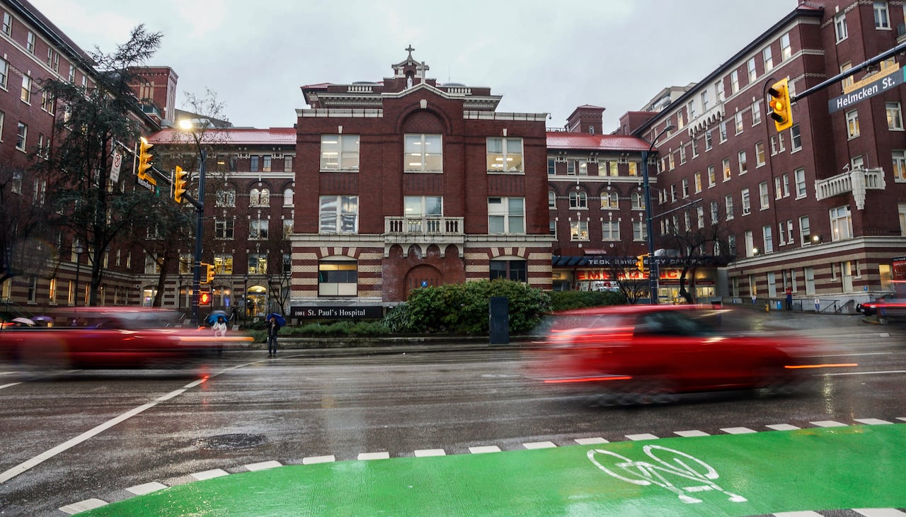 A hospital site with a Christian cross atop its facade.